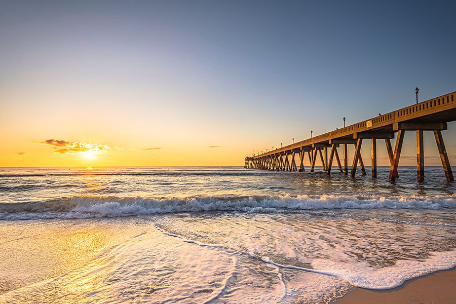 Carolina Beach NC Insurance - North Carolina Beach And Sun Down With The Waves Washing In On The Sand